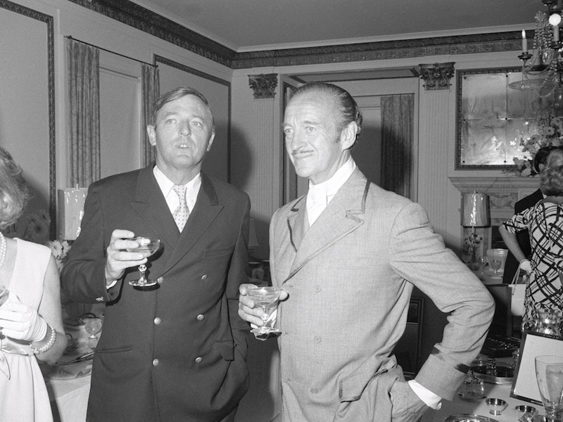 David Niven chats with author and magazine publisher William Buckley. (Photo by Bettmann/Getty Images)