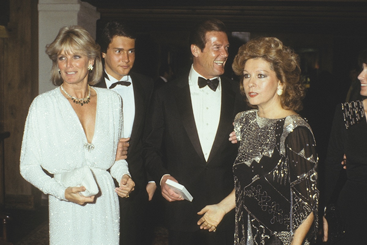 Linda Evans, Roger Moore and Luisa Moore (Photo by Bertrand LAFORET/Gamma-Rapho via Getty Images)