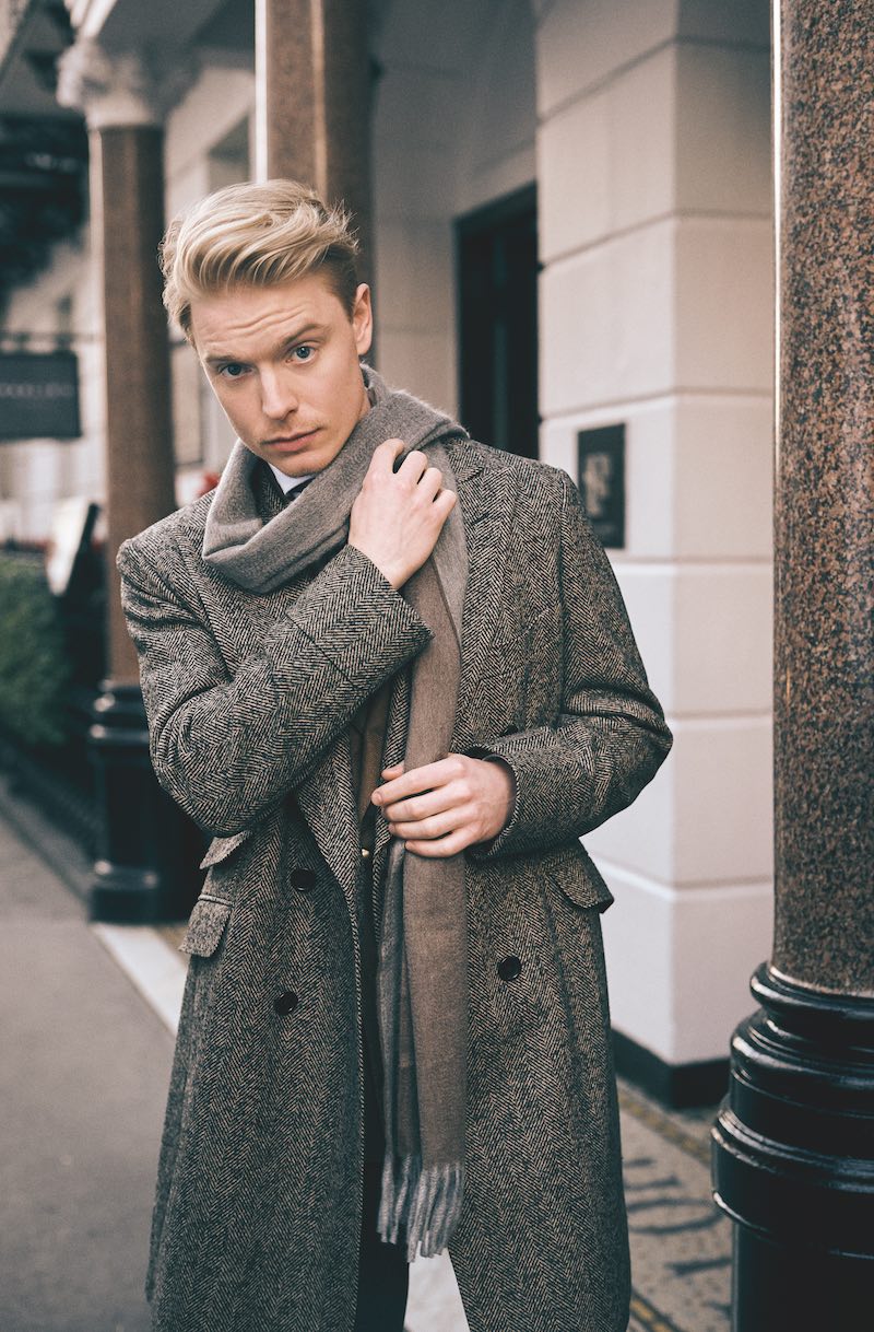 Brown cashmere and wool herringbone overcoat, B Corner; brown wool jacket, Lardini; cream cotton shirt, Alessandro Gherardi; blue and brown silk tie, Rubinacci; brown and grey cashmere scarf, Emma Willis.