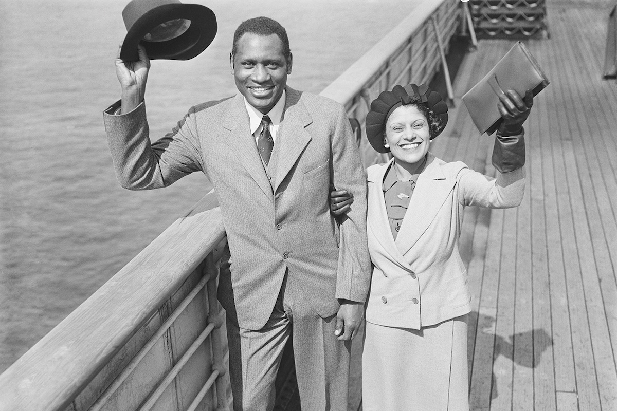 Paul Robeson and his wife arrive in Manhattan after a successful tour of Europe in 1935. (Photo via Getty)