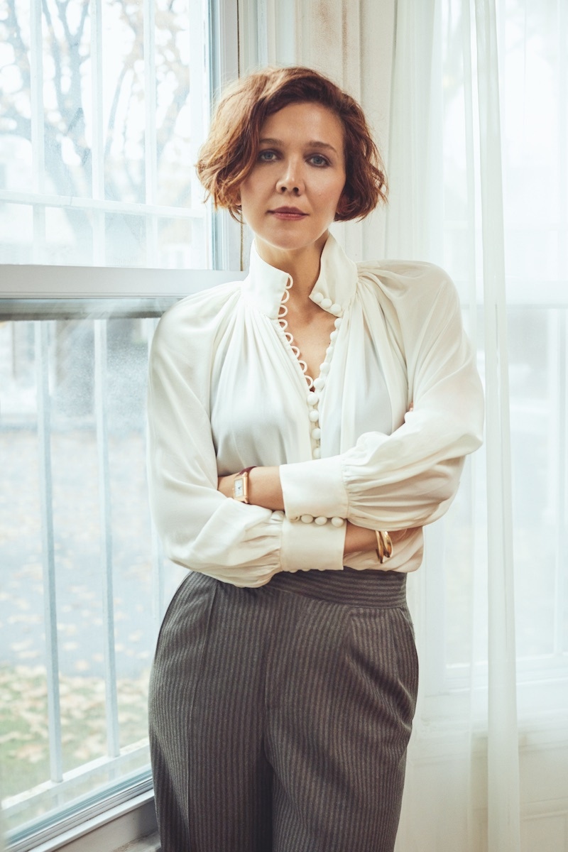 Brown double-breasted block stripe flannel suit, Edward Sexton; white silk blouse, Zimmerman at Matches; gold leather shoes, Malone Souliers.