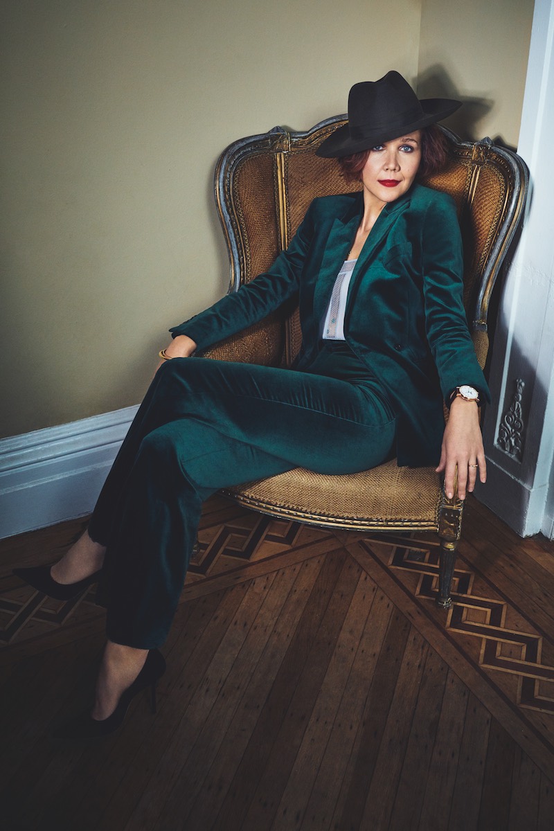 Emerald green velvet suit, The Deck; olive green felt fedora, Lock & Co; grey Olympie bodysuit in stretch jersey and bobbin mesh lace trim, ERES; black leather shoes, Jimmy Choo; Classique wristwatch in rose-gold, Breguet.