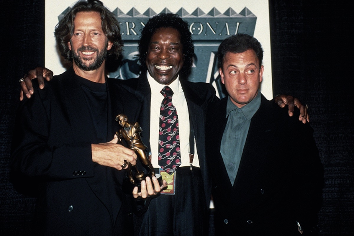 Eric Clapton, Buddy Guy and Joel attend the second annual International Rock awards in New York in 1990 (Photo by Images Press/IMAGES/Getty Images)