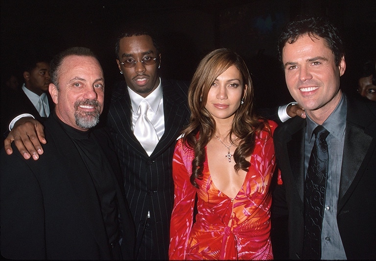 At a Party for the 42nd Grammy Awards with the then Puff Daddy (now Sean Combs), Jennifer Lopez and Donny Osmond.