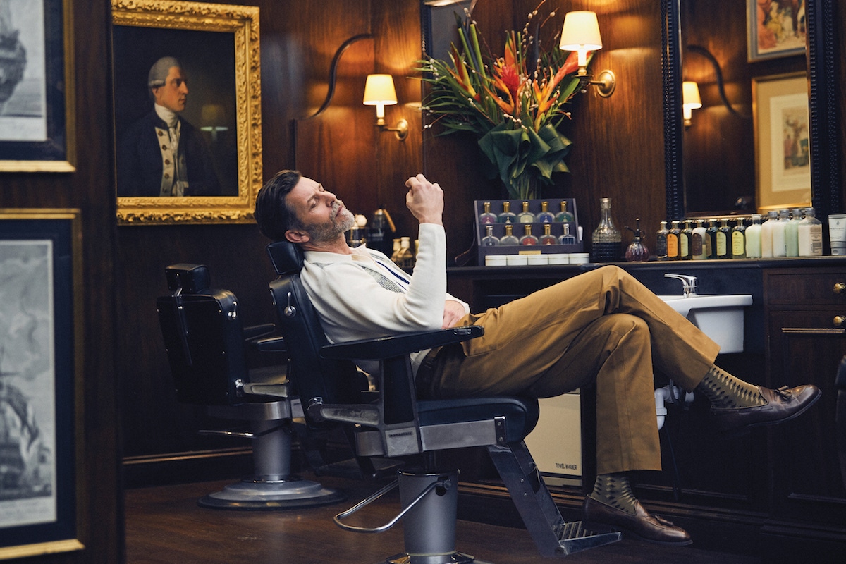 Cream, blue and yellow wool knitted shirt and nutmeg brown cotton pleated trousers, both King & Tuckfield at The Rake; brown and beige cotton socks, The London Sock Company x Ilaria Urbinati; tan leather tassel loafers, Crockett & Jones.