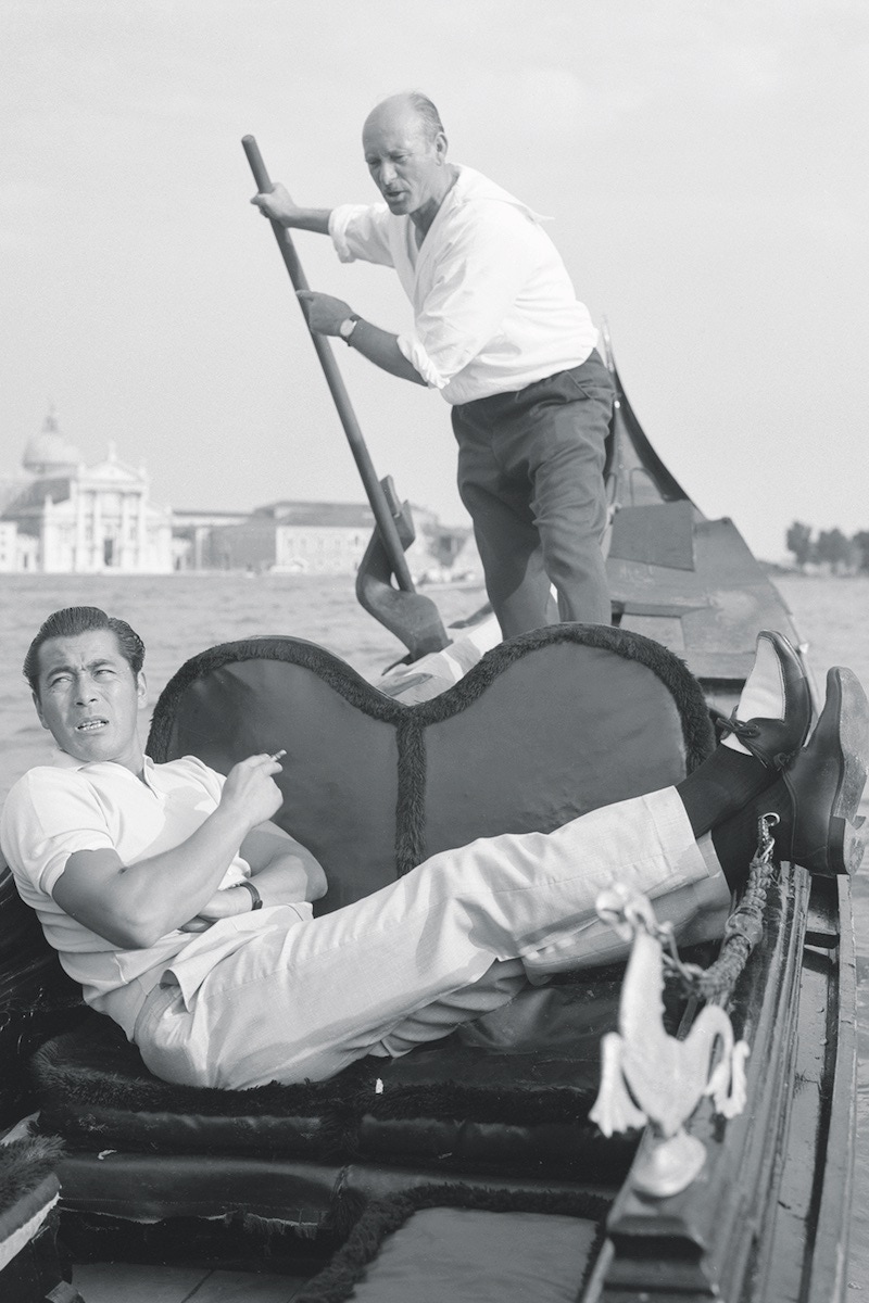 Japanese actor Toshiro Mifune, lying on a gondola in Venice, 1961. (Photo by Archivio Cameraphoto Epoche/Getty Images)