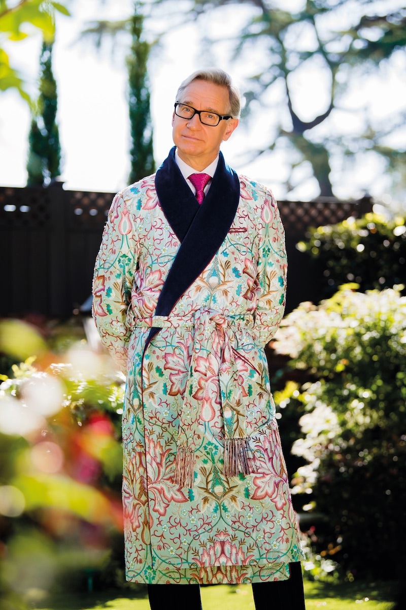 Embroidered summer-tone dressing gown with tasselled belt, New & Lingwood; pink party balloon tie, Charvet; white bespoke shirt, Anto of Beverly Hills; eyewear, Prada; antique gold-tipped walking stick; white-gold and onyx ring, Cartier; Root Beer GMT, Rolex.