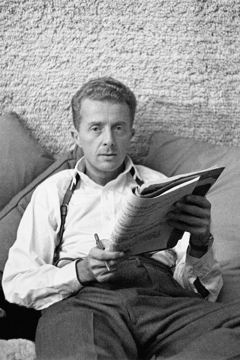 Paul Bowles, seated with manuscript. Image by © Condé Nast Archive/Corbis