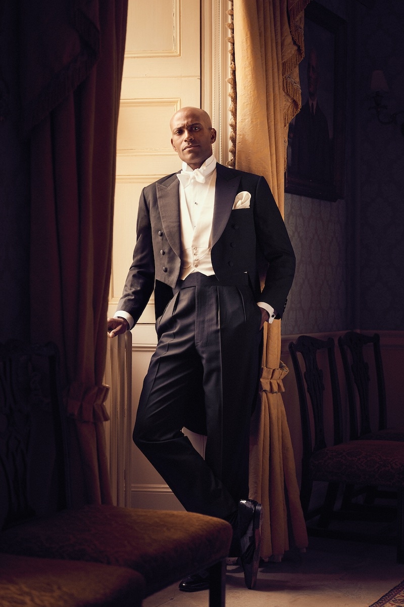 Black feather weave tailcoat and black wool brace trousers with double-braid side seams, white Marcella waistcoat with four white pearl buttons and white stiff bib shirt front and cuff with detachable wing collar and white Marcella bow-tie, all by Henry Poole & Co; patent leather black tie pumps, George Cleverley; Rhodium and Onyx dress set, Codis Maya at TheRake.com; pocket- watch, property of The Rake.