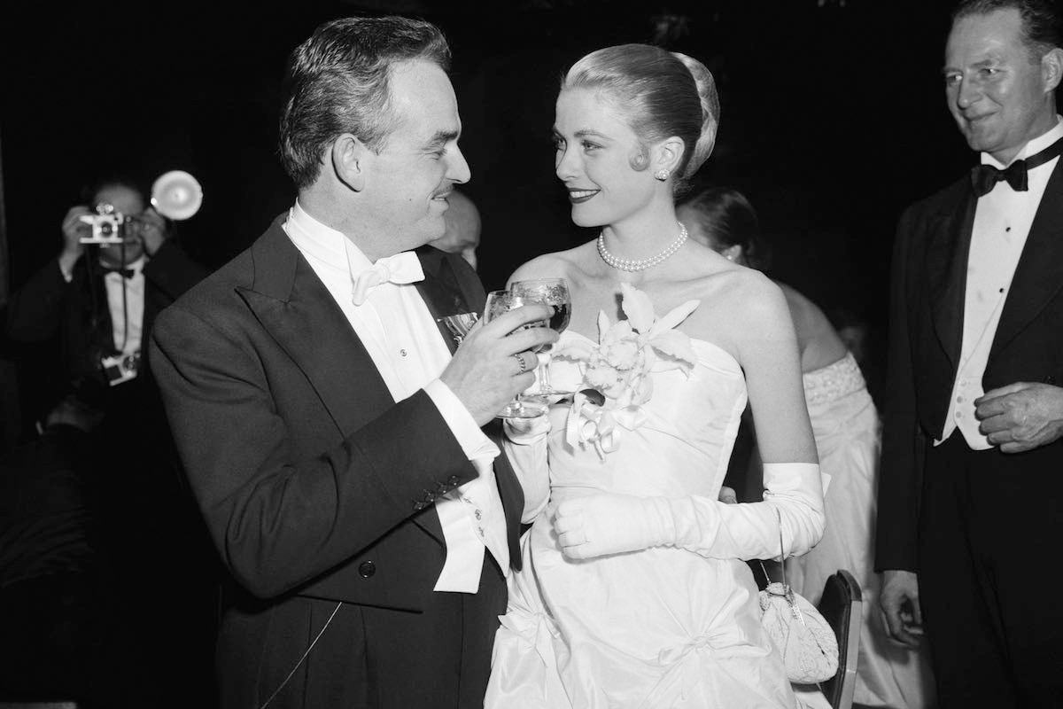 Grace Kelly and her fiance Prince Rainier III of Monaco, toast each other during 