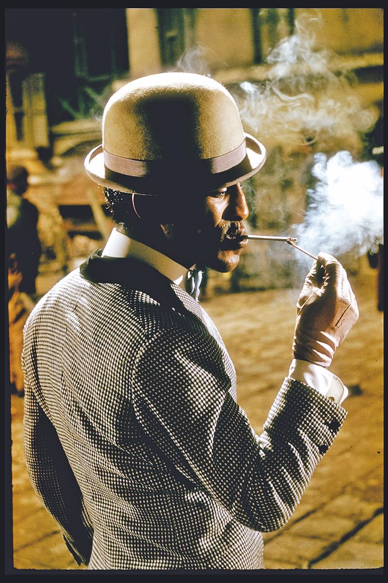 Lighting a cigarette in Porgy and Bess, 1959.  (Photo by Gjon Mili/The LIFE Picture Collection via Getty Images)