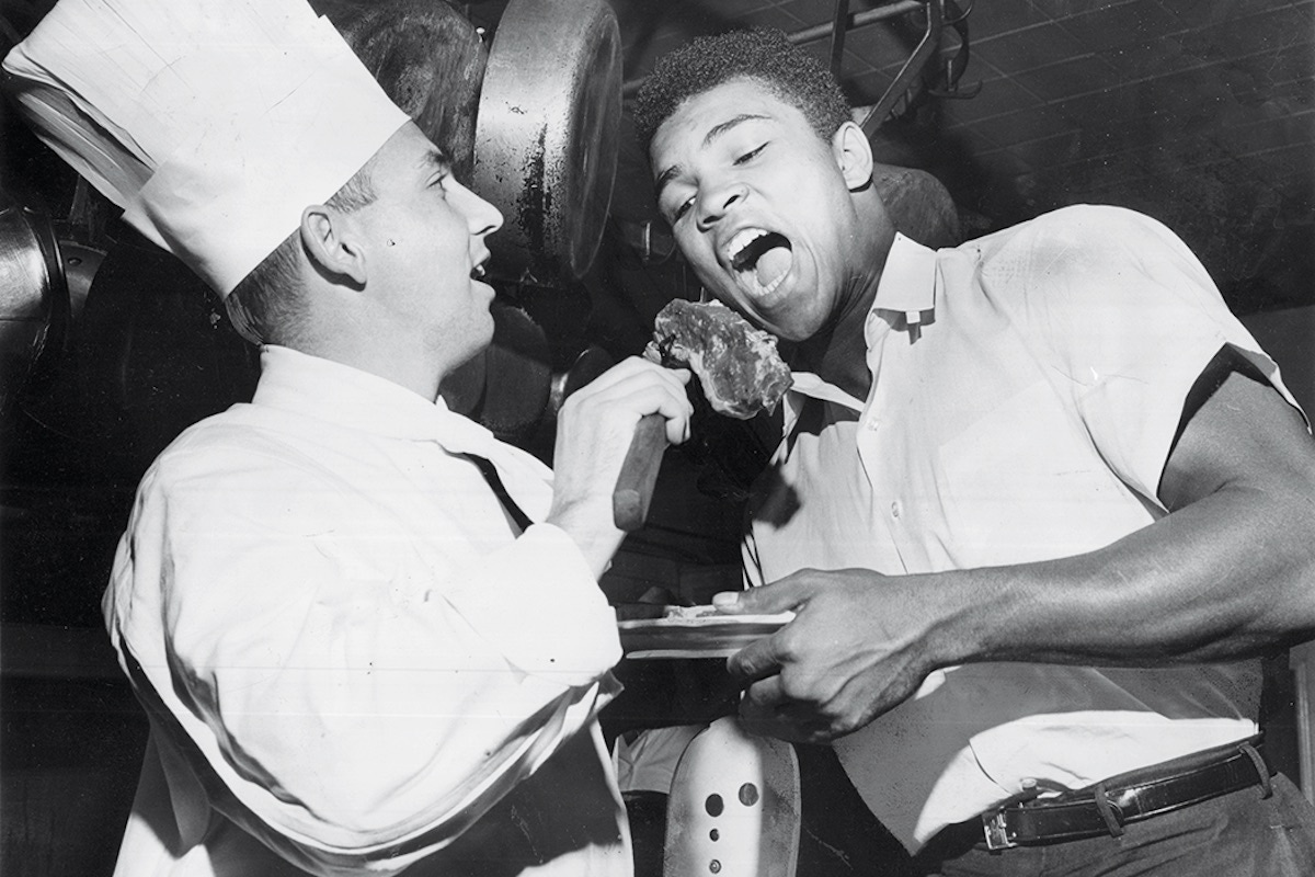 Approving a steak that hotel chef Anton Bodner picked out for Ali’s dinner in 1962 (Photo courtesy of Getty Images)