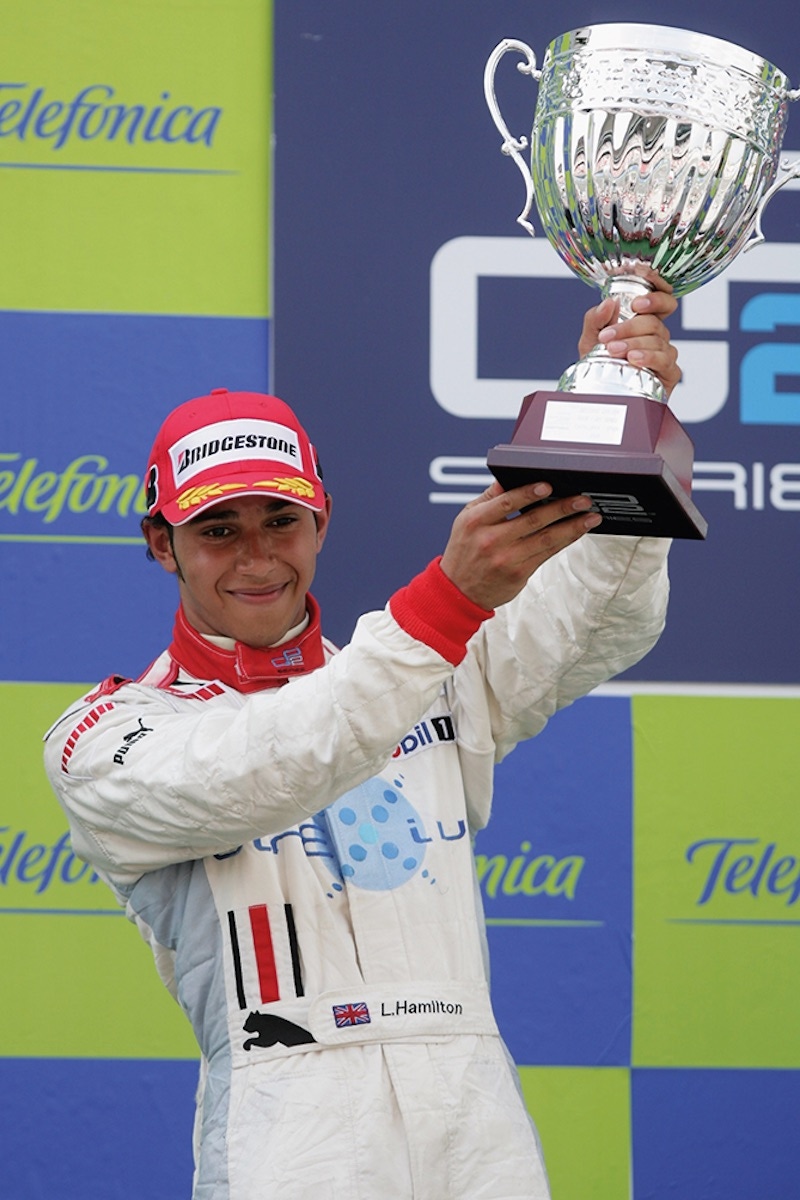 On the podium after the GP2 race at the Circuit de Catalunya, 2006. (Photo by Mark Thompson/Getty Images)