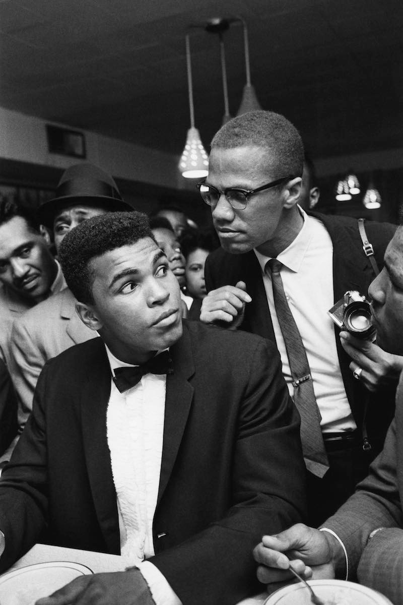 Malcolm X and Ali, then Cassius Clay, after Ali beat Sonny Liston in Miami, 1964 (Photo courtesy of Getty Images)