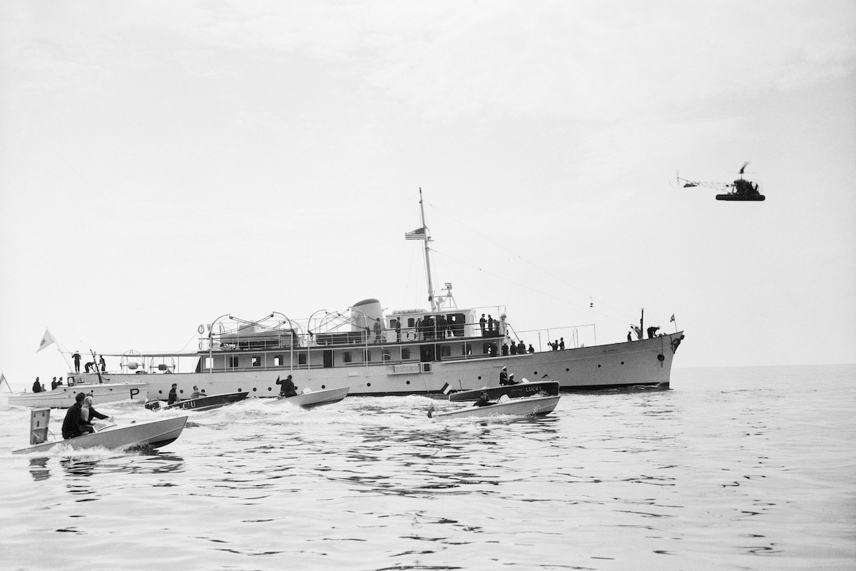 Some of the scores of small craft that surrounded Prince Rainier's yacht to welcome actress Grace Kelly are shown bobbing on the choppy waters of Monaco Bay shortly after the princess-to-be was escorted aboard by Prince Rainier.  (Image by © Bettmann/CORBIS)