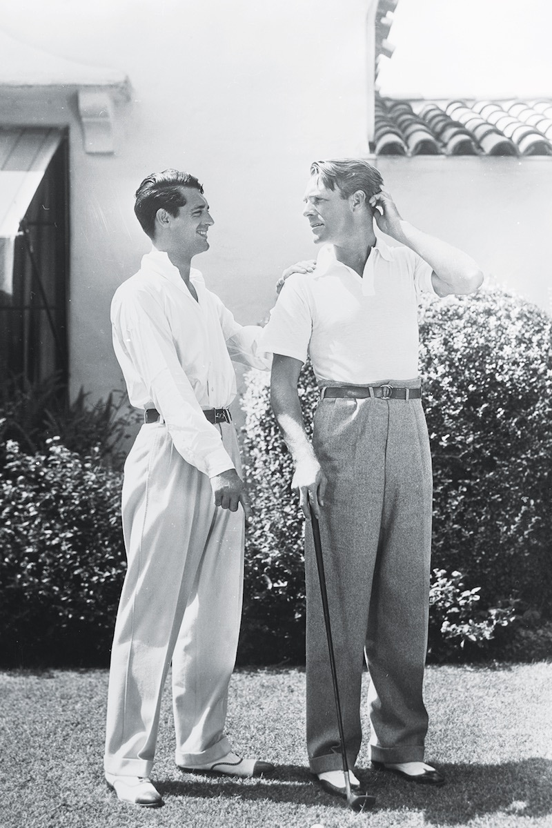 British born actor Cary Grant (1904 - 1986), born Archibald Leach, with the American actor, Randolph Scott (1898 - 1987). The two stars shared a beach house during the 1930's, which was jokingly known as Bachelor Hall. (Photo via John Kobal Foundation/Getty Images)