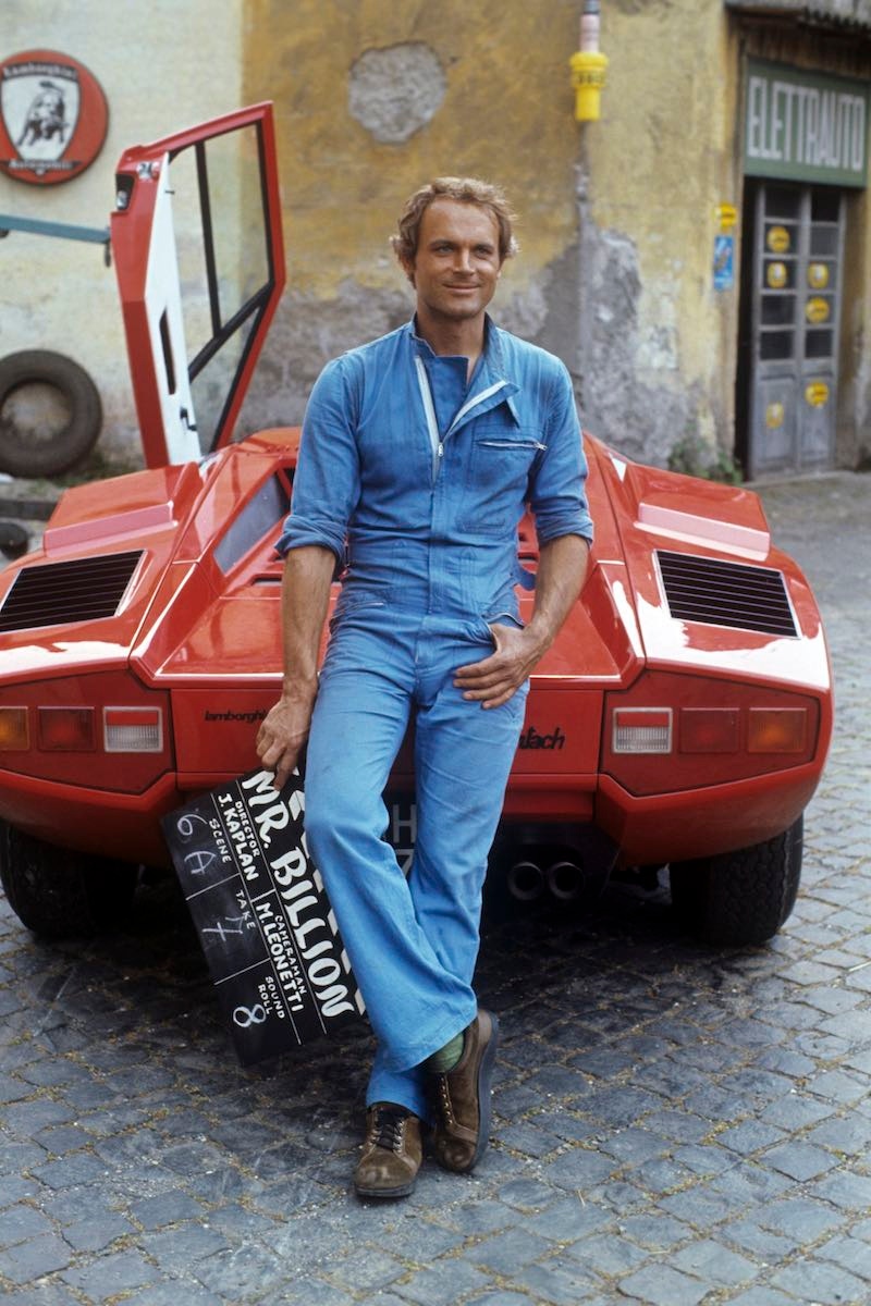 Leaning on a Lamborghini on the set of Mr. Billion, 1976 (Photo by Rino PetrosinoMondadori via Getty Images)