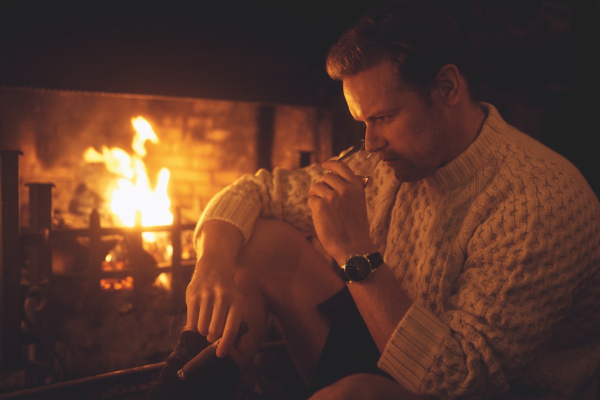 Milo Luxe Honeycomb cashmere jumper, Johnstons of Elgin; kilt, Sassenach Tartan; socks and kilt pin, Sam’s own; black Utah ‘Kentmere’ boots, Edward Green at The Rake; Code 11.59 byAudemars Piguet Selfwinding Chronograph, 18-carat white-gold case, lacquered black dial and counters. Black alligator strap with white-gold buckle.