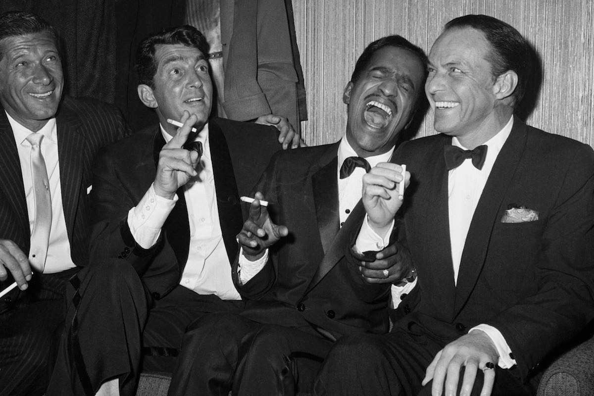 Rat Pack members Dean Martin, Sammy Davis Jr., and Frank Sinatra as the group unwinds backstage at Carnegie Hall after entertaining at a benefit performance in honor of Dr. Martin Luther King Jr. (Image by © Bettmann/CORBIS