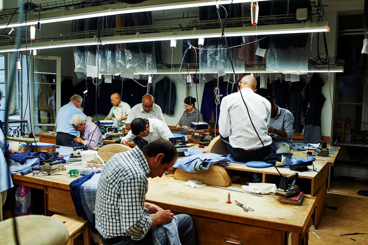 A demonstration of the different handcrafted techniques that go into a bespoke suit: of course lots of teamwork