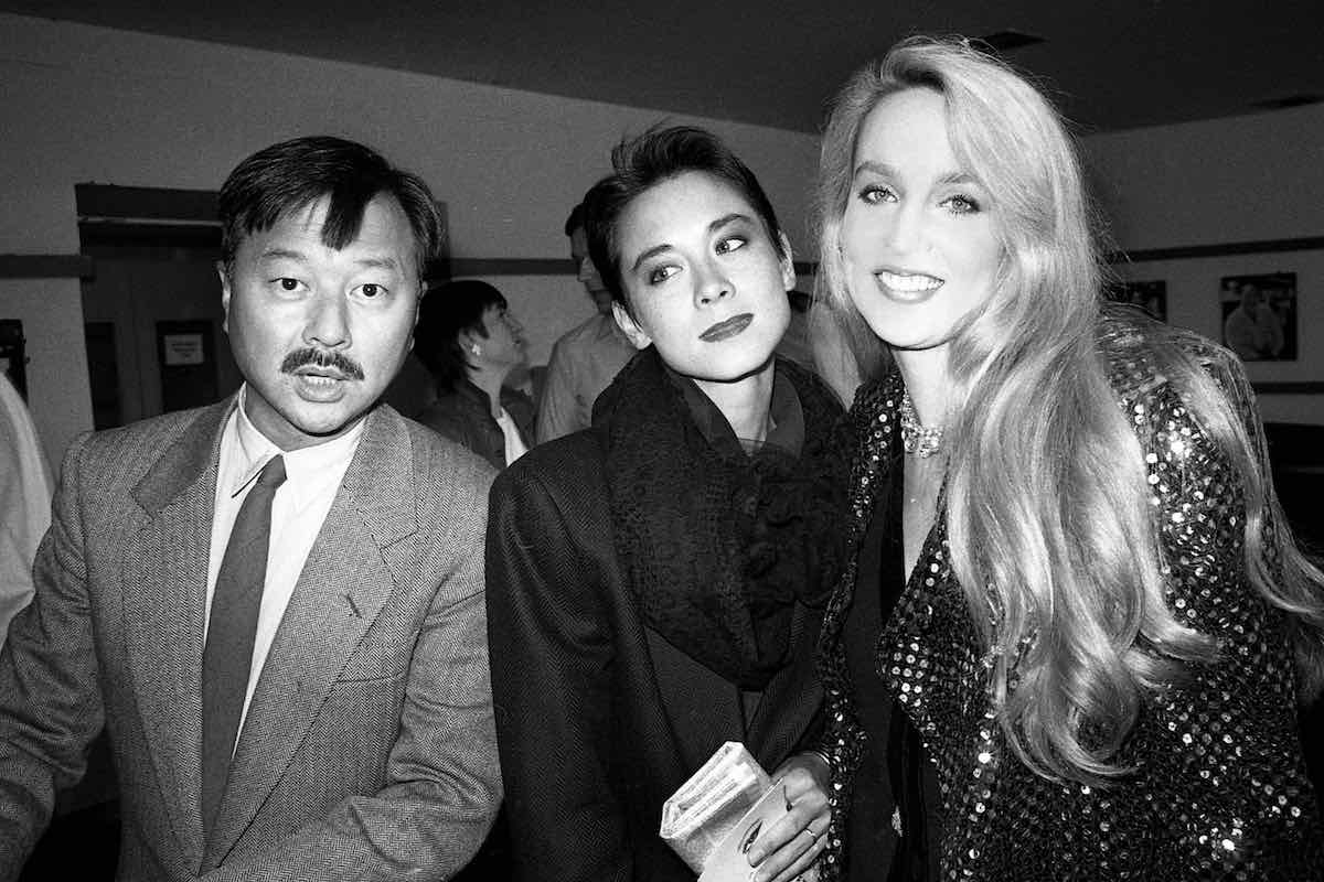 Michael and Tina Chow attending a book launch with Jerry Hall, 1985 (Photo by Alan Davidson/Silverhub/REX/Shutterstock (7529110ai)