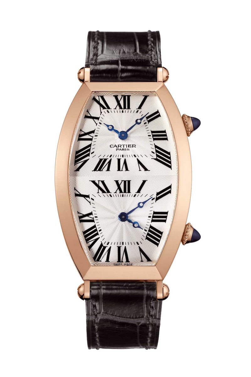 A 2005 example of a Collection Privée Cartier Paris (CPCP): Tonneau Dual Time Zone watch; 15.33mm by 2.9mm, powered by the 9770 MC movment, which features two tiny mechanical movements that can be independently set by the individual corresponding crowns