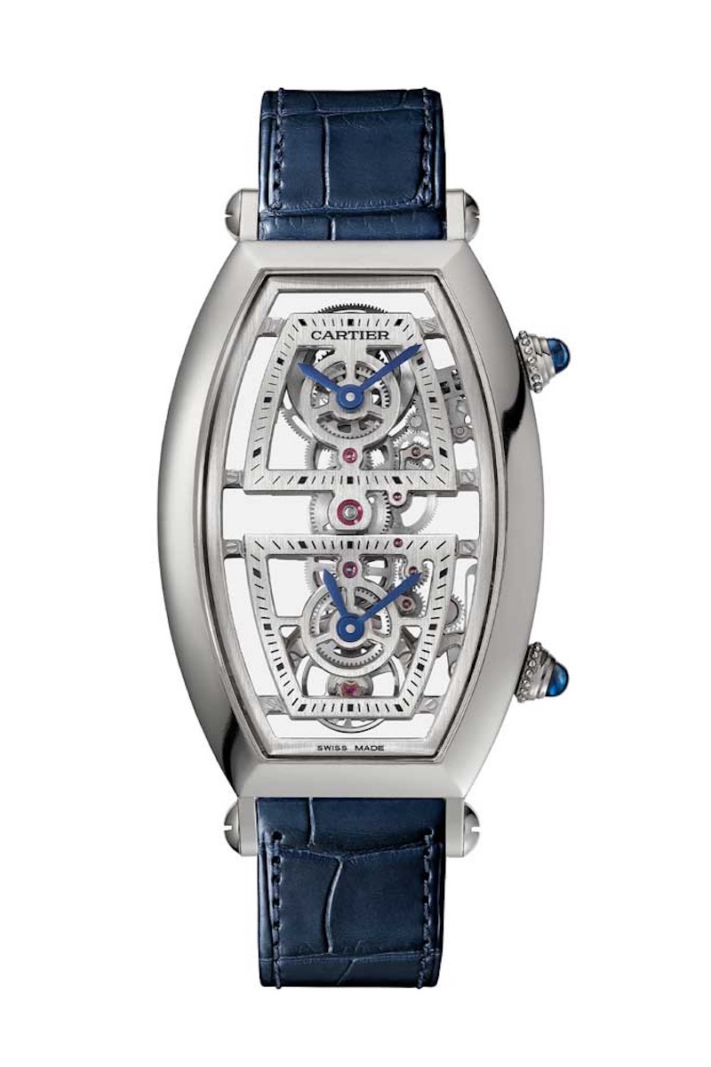 Cartier Prive Skeleton Dual Time Zone Tonneau Watch lanched at SIHH 2019; features an all-new movement, which is actually an extended linear gear train with a single balance and a centre wheel that splits off into two additional trains for each indication: this watch is different in that the crown at the bottom advances the lower hour hand only and while the CPCP watches' crowns were totally independent, here the minute hands are synchronised