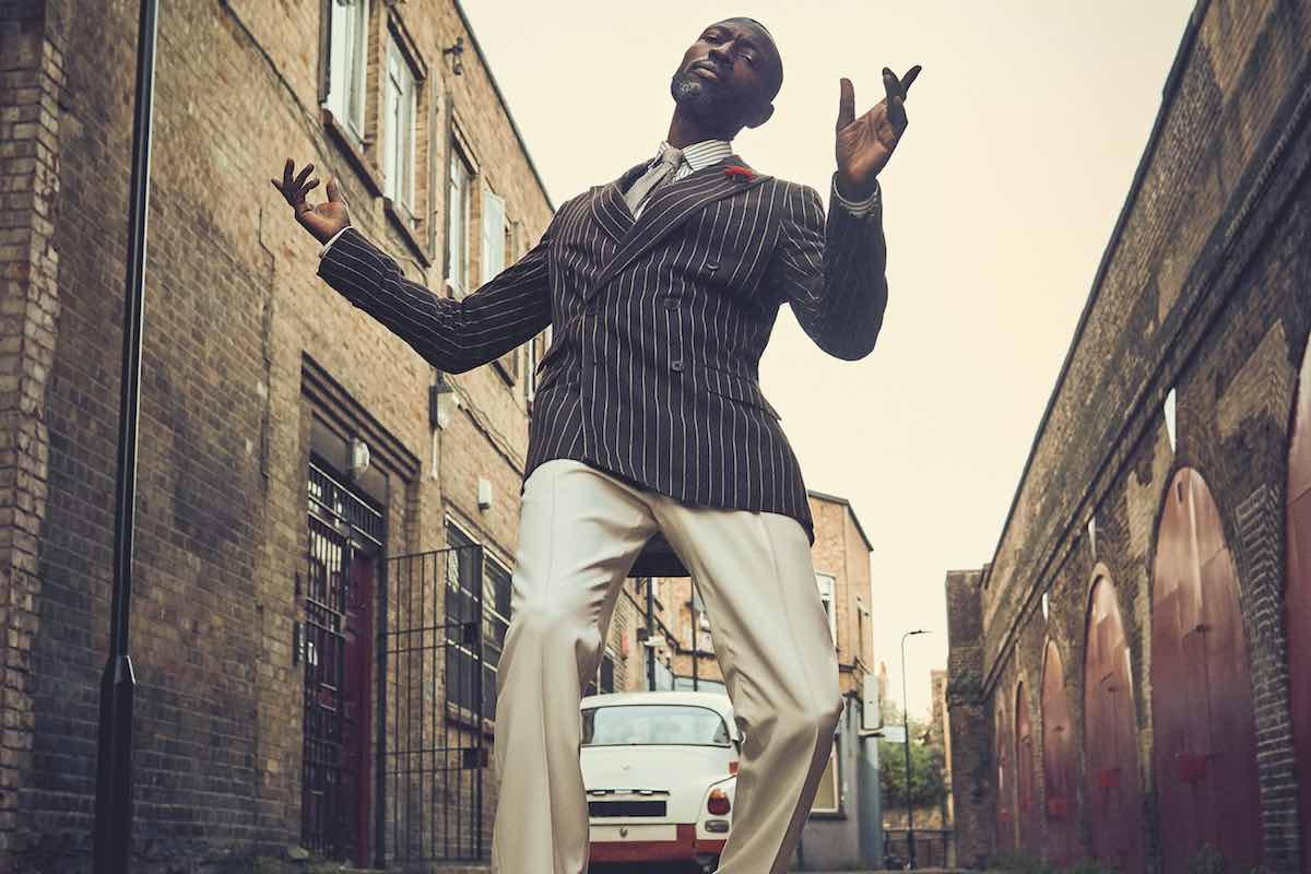 Brown wool pinstripe double-breasted jacket, black and white dress shirt and brown silk checked tie, cream wool front-pleated trouser, all Ralph Lauren Purple Label; grey socks, London Sock Company at The Rake; black leather loafers, Crockett & Jones.