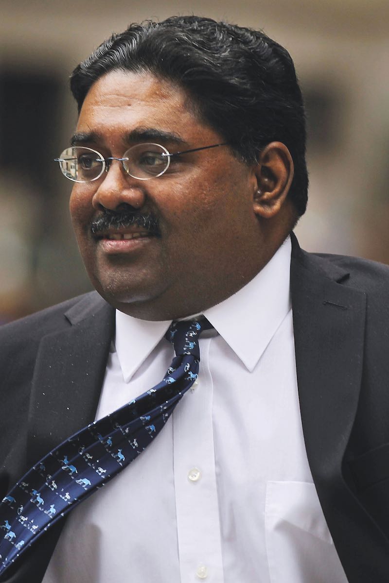 Rajaratnam enters a Manhattan court while on trial for insider trading in 2011 (Photo by Spencer Platt/Getty Images)