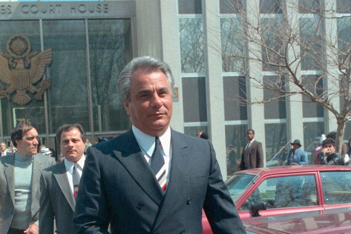 The Dapper Don impeccably dressed in a double-breasted grey flannel suit following his trail for racketeering, 1986. (Photo via Getty)