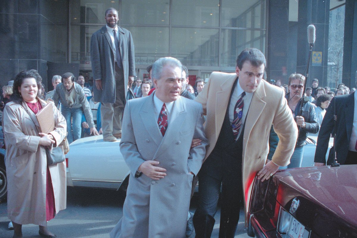 John Gotti being escorted through crowd (Photo via Getty)