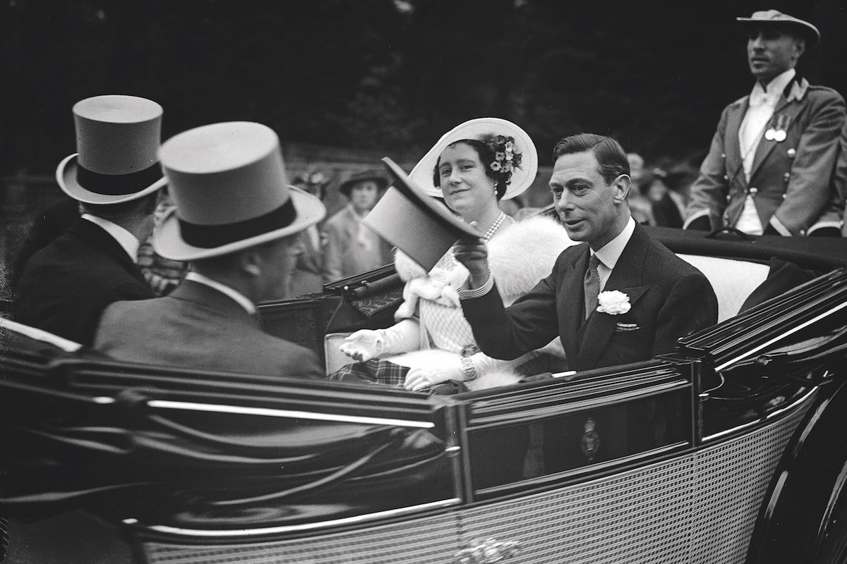 King George VI and Queen Elizabeth (later the Queen Mother) ride in their carriage on Royal Hunt Day at Ascot races (Photo by Popperfoto/Getty Images)