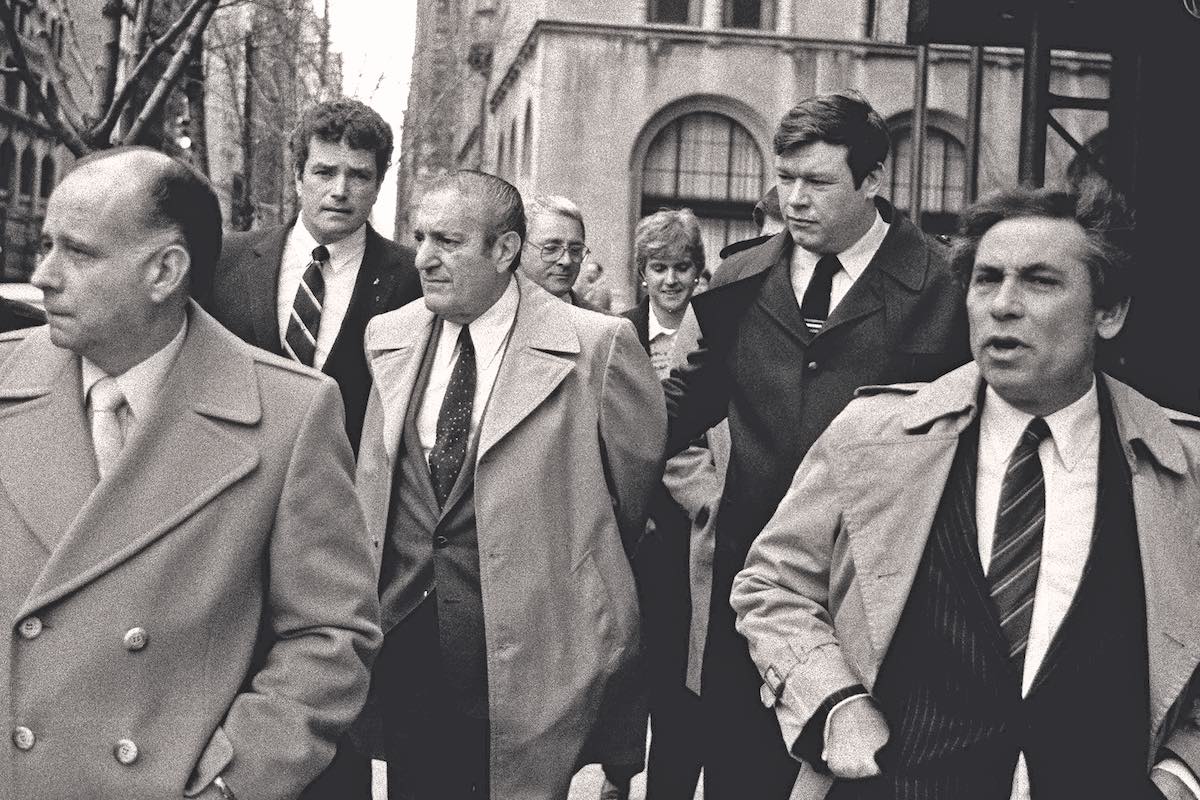 Paul Castellano, former mob boss, who Gotti had killed, is escorted by FBI agents following his surrender in 1984 (Photo by Thomas Monaster/NY Daily News Archive via Getty Images)