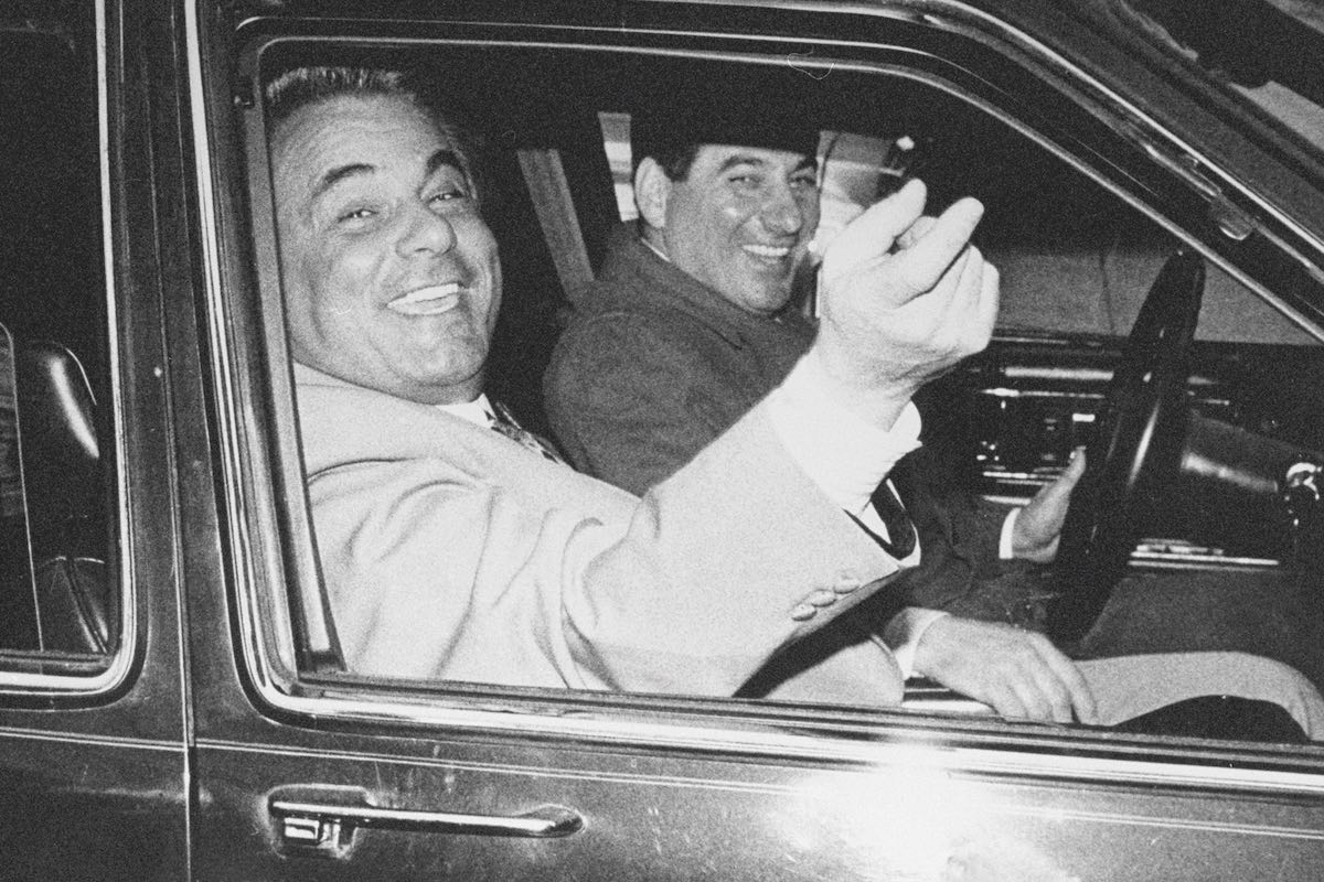 Gotti, elated and acquitted of assault and conspiracy, with his driver in New York, 1986. (Photo by NY Daily News Archive via Getty Images)