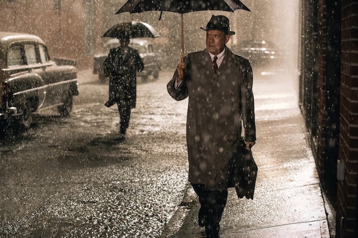 Tom Hanks wearing a mackintosh-style coat in Bridge of Spies, 2015.