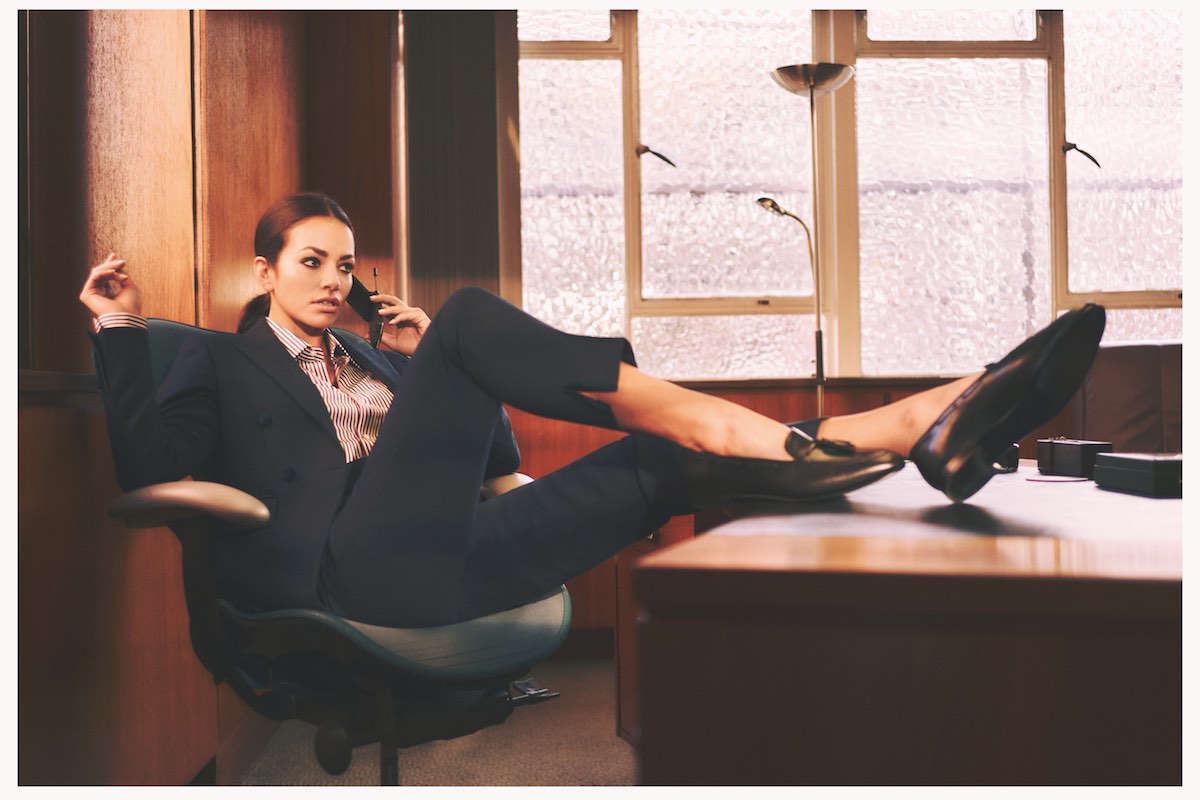 Blue and red striped cotton shirt, Emma Willis; teal flannel suit, Caroline Andrew; black leather tassel loafers, Ralph Lauren Purple Label.