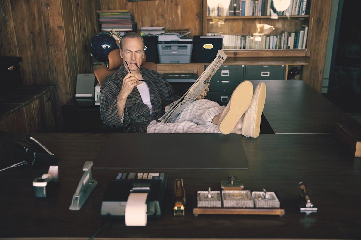 Check robe and cream-striped pyjama pants, Gucci; camel furry slippers, Jimmy Choo; tiger stone signet ring, David Yurman; reading glasses, Jacques Marie Mage. Watch and wedding ring, property of Bob Odenkirk.