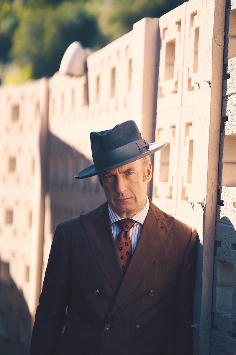 Brown pinstriped jacket, pants, white/brown stripe shirt and brown paisley tie, Lardini; grey bash fedora, Nick Fouquet.