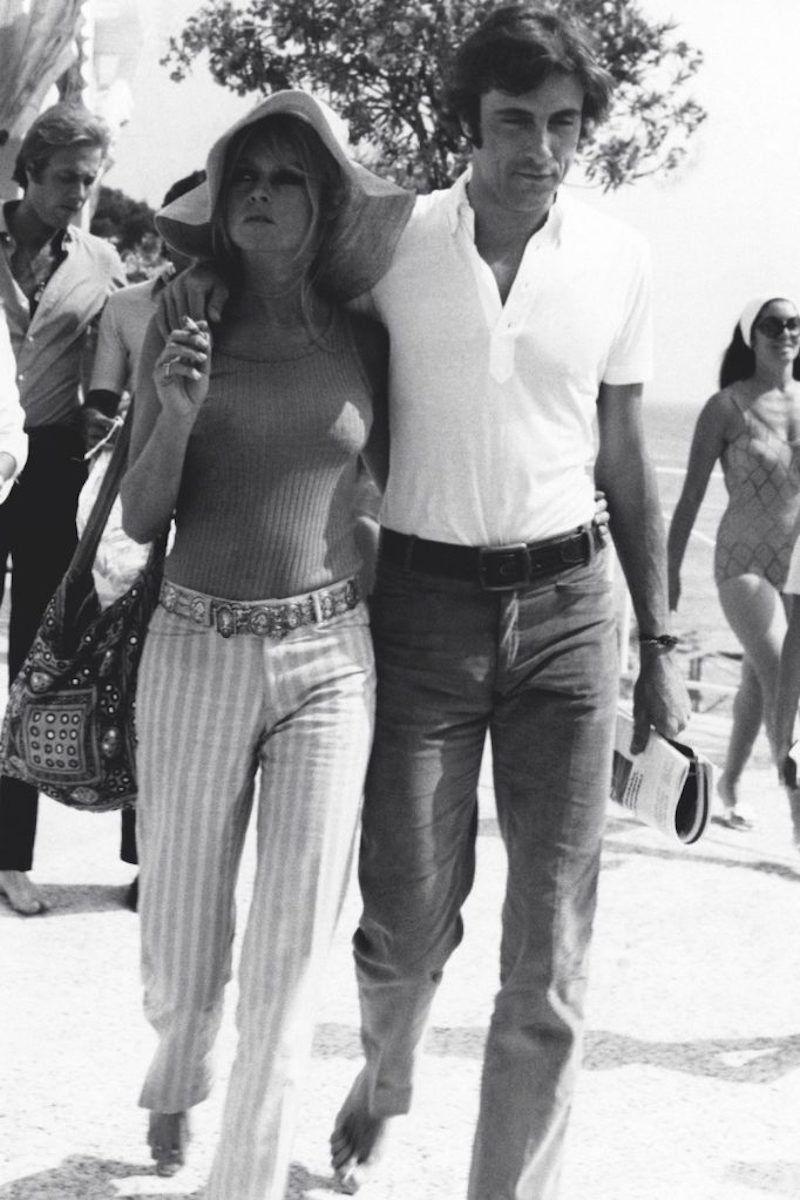Brigitte Bardot walking with the Italian actor and playboy Gigi Rizzi in Saint-Tropez, 1968 (Photo by Mondadori Portfolio via Getty Images)