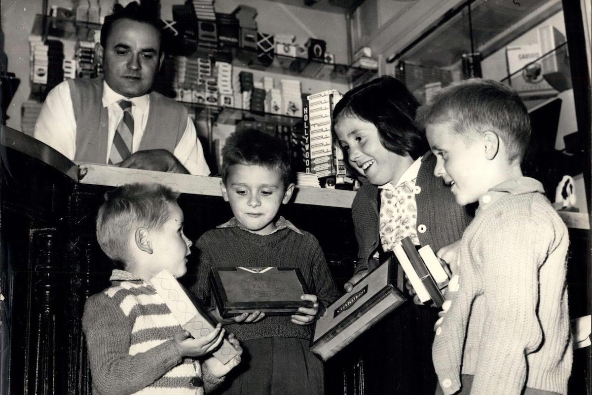 Young Parisians buying cigarettes and cigars as a present for Father's Day. (Photo via Alamy)