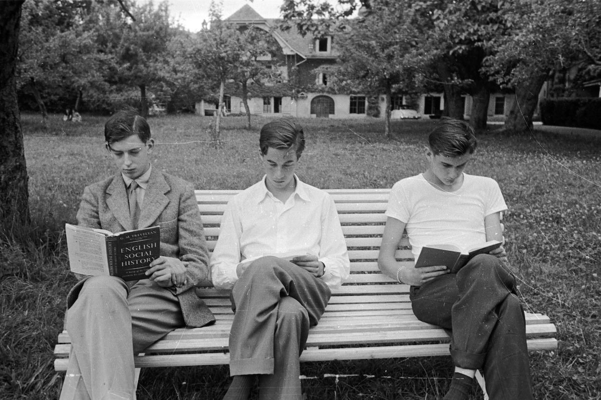 Edward George, Duke of Kent (left) revises from a book on English Social History for his end of term exams at Le Rosey boys' school in Geneva. Original Publication: Picture Post - 6609 - The Last Days At School With The Duke Of Kent - pub. 1953 (Photo by Kurt Hutton/Picture Post/Getty Images)
