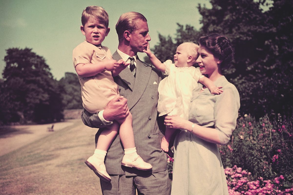 An affectionate moment when Princess Anne reaches out to her father in 1951 (Photo via Getty)