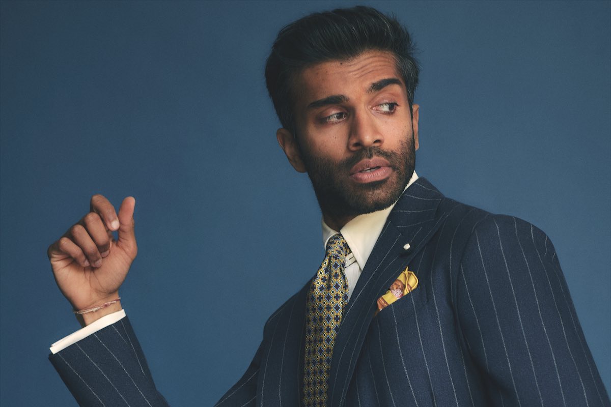 Navy hopsack pinstripe double-breasted suit, Lardini; yellow cotton tab-collar shirt, Edward Sexton at The Rake; yellow and navy silk print tie and yellow print silk pocket-square, both Rubinacci.