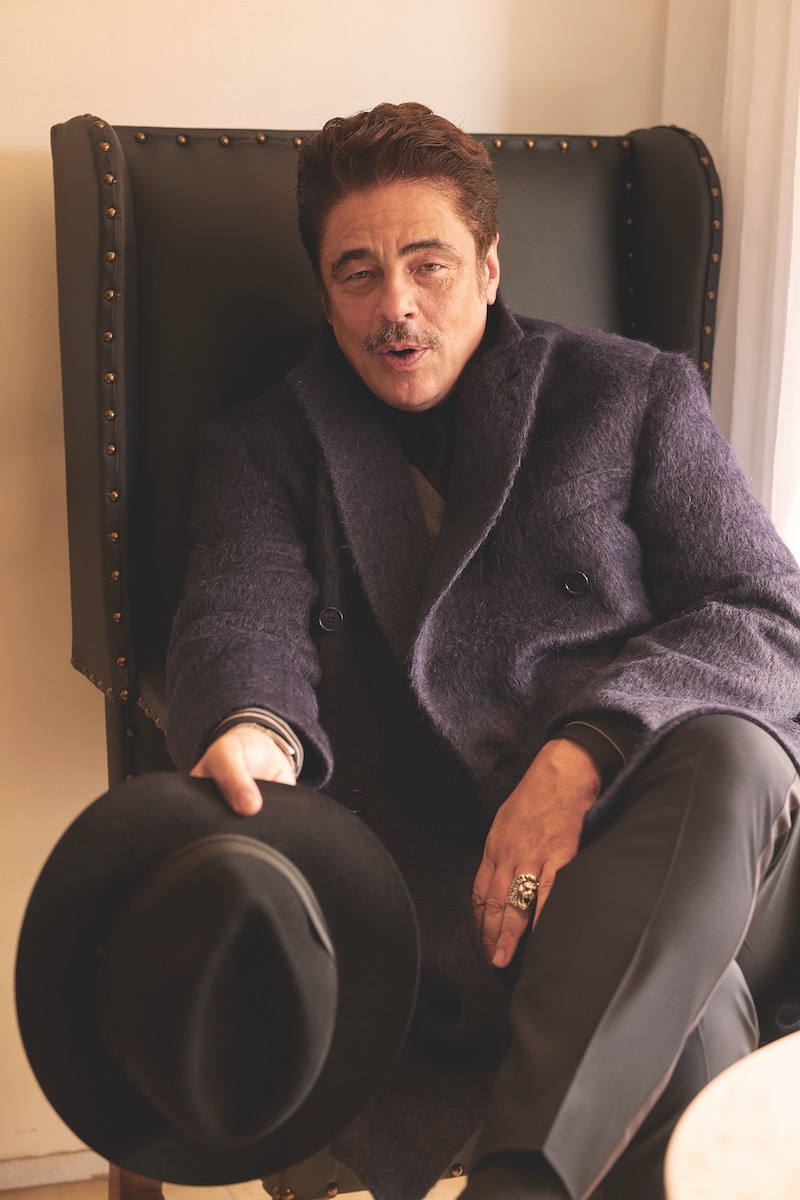 Double-breasted overcoat, Brioni; grey cardigan, Brunello Cucinelli; trousers, Giorgio Armani; black fedora with grey ribbon, Borsalino