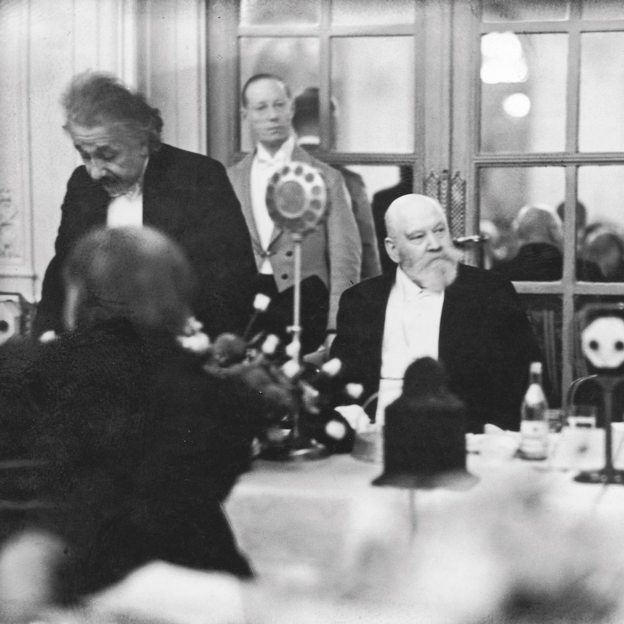 At a gala at the Savoy Hotel, flanked by Albert Einstein and George Bernard Shaw