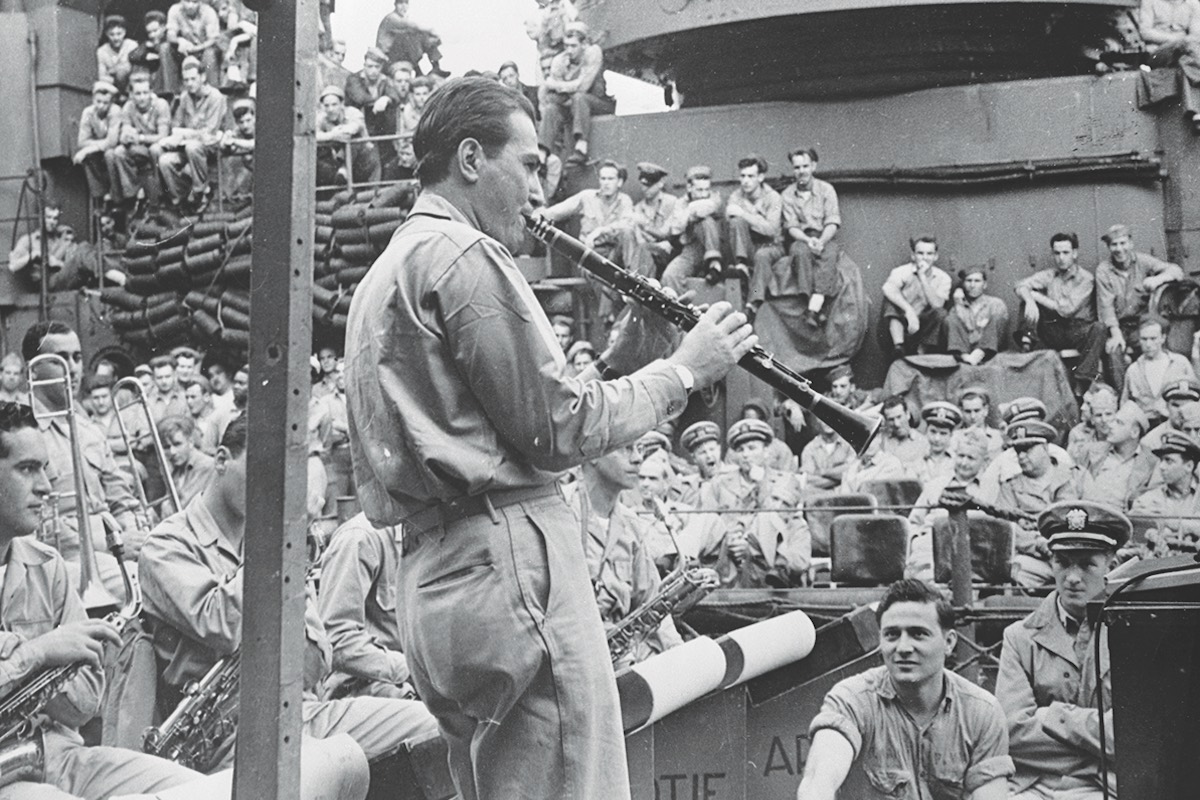 Some light entertainment for his fellow sailors during a deployment in the South Pacific in 1943 (Photo via Getty)