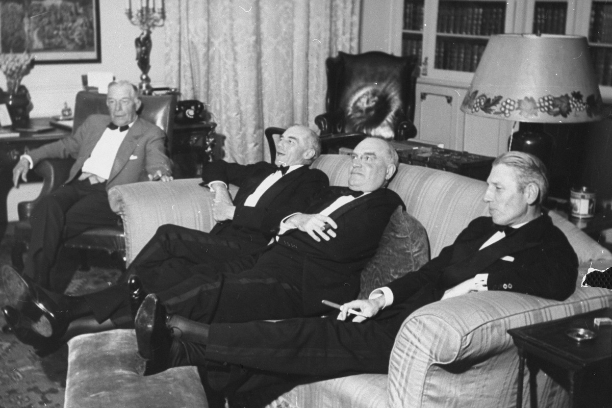 After dinner, the gentlemen retire ont heir own, talking over the day's shoot. (Photo by John Phillips/The LIFE Picture Collection/Getty Images)