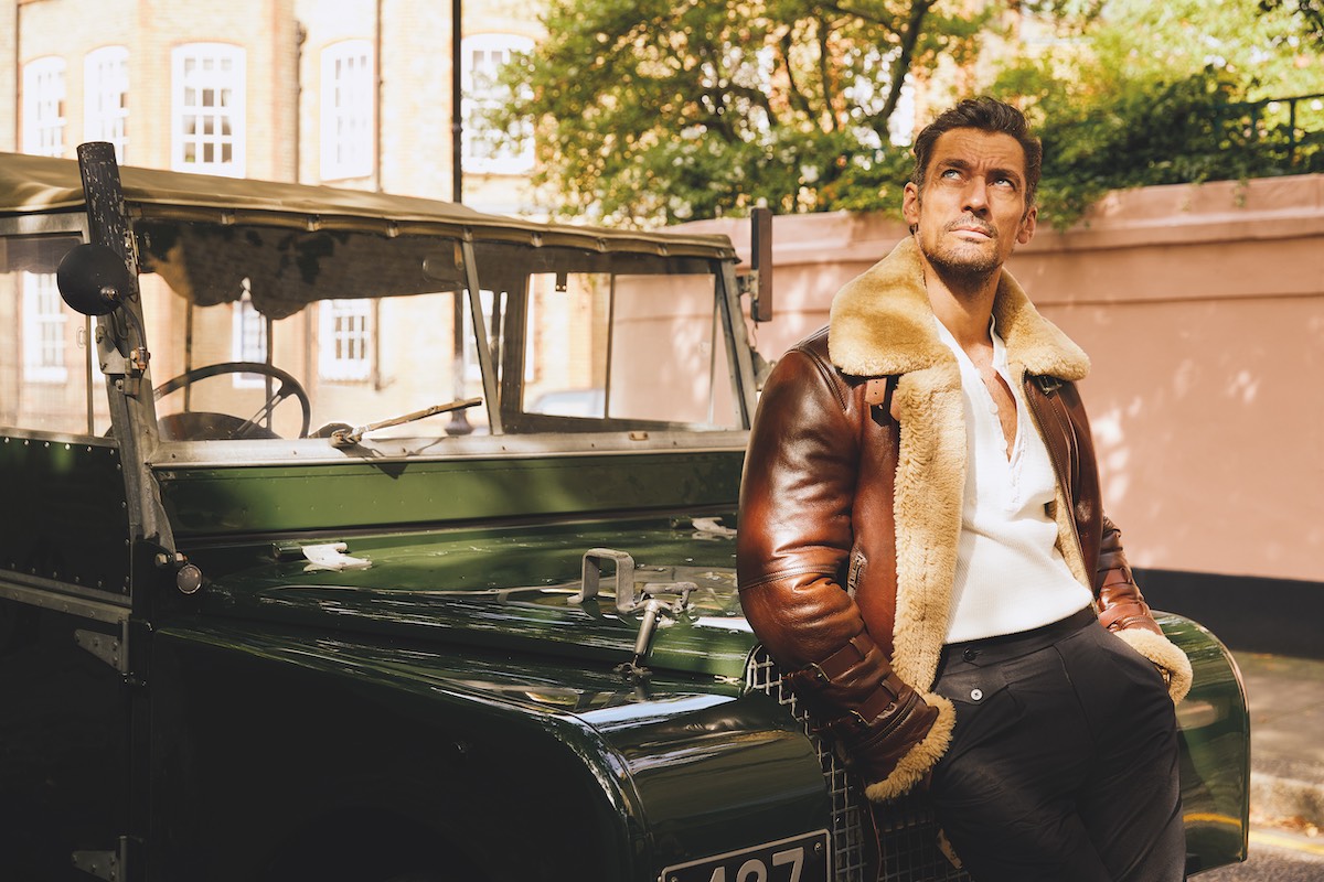 Brown leather and shearling Douglas jacket, Cromford Leather; white heritage Henley in 100% cotton, David Gandy Wellwear; charcoal flannel single pleat trousers, New & Lingwood.