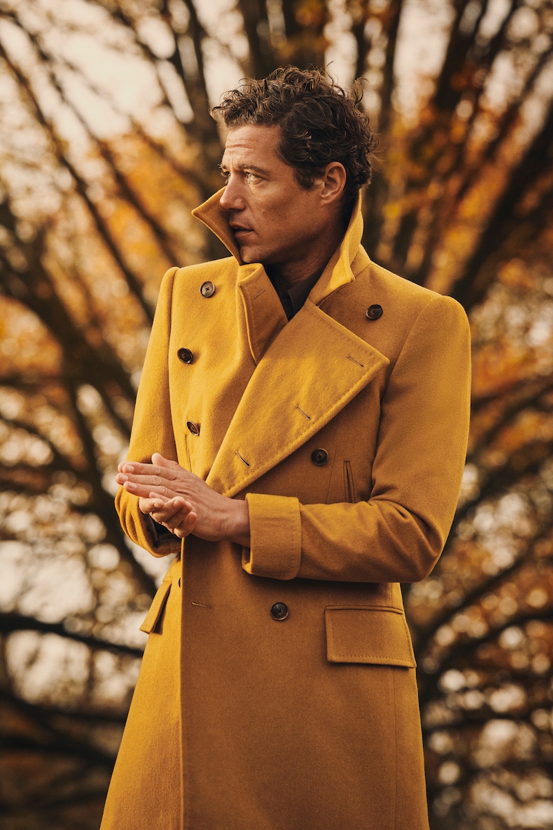 Edward Sexton vibrant turmeric yellow wool Bridgecoat (Photo by Kim Lang)Paul Theroux at Clapham Junction, London, 1978