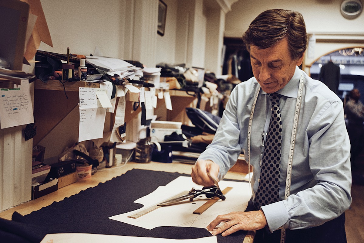 Cutting and the first fitting: Terry Haste marks out the fabric using Tom’s paper pattern.